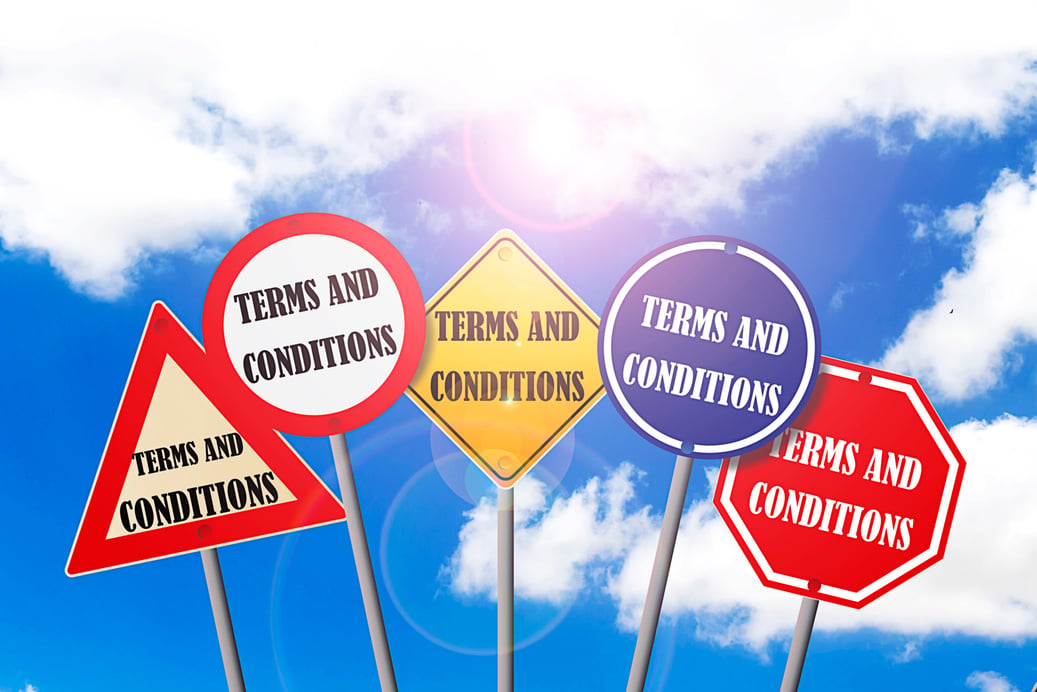 several signs with the words terms and conditions on them